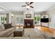 Warm living room with hardwood floors, fireplace, and natural light, creating an inviting space for relaxation at 471 Henderson Lake Dr, Canton, GA 30115