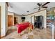 Cozy room with tiled floors that connects a living area with a fireplace to a dining area, all under a ceiling fan at 471 Henderson Lake Dr, Canton, GA 30115