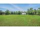 Scenic view of a sprawling pasture with a horse grazing peacefully, surrounded by trees at 471 Henderson Lake Dr, Canton, GA 30115