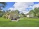 Spacious backyard with charming stone retaining wall and covered access to the basement at 4911 Old Douglasville Rd, Lithia Springs, GA 30122