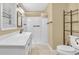 Well-lit bathroom featuring a shower, vanity, and toilet at 4911 Old Douglasville Rd, Lithia Springs, GA 30122