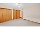 Cozy bedroom with carpet, closet space, and an open doorway at 4911 Old Douglasville Rd, Lithia Springs, GA 30122