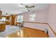 Bright dining area adjacent to the kitchen, featuring hardwood floors and natural light at 4911 Old Douglasville Rd, Lithia Springs, GA 30122
