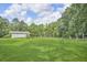 Large backyard with covered outdoor seating at 4911 Old Douglasville Rd, Lithia Springs, GA 30122