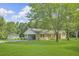 Spacious property with a detached garage and a well-maintained lawn with mature trees at 4911 Old Douglasville Rd, Lithia Springs, GA 30122
