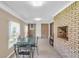 Enclosed sunroom featuring tile floors, brick accent wall with fireplace, and backyard views at 4911 Old Douglasville Rd, Lithia Springs, GA 30122