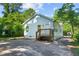 Charming home with a backyard view, featuring ample parking and mature trees at 5 Windsor Ter, Avondale Estates, GA 30002
