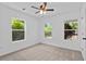 Bright bedroom with large windows and neutral carpet, offering a cozy and inviting space at 5 Windsor Ter, Avondale Estates, GA 30002