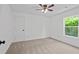 Comfortable bedroom with a ceiling fan and a large window that lets in plenty of natural light at 5 Windsor Ter, Avondale Estates, GA 30002