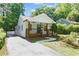 Inviting home with a classic front porch and neatly kept driveway leading to the residence at 5 Windsor Ter, Avondale Estates, GA 30002