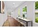Bright hallway with bar seating, wood floors and natural light from windows at 5 Windsor Ter, Avondale Estates, GA 30002