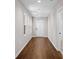 Bright hallway with hardwood floors, white walls, and a white front door at 5 Windsor Ter, Avondale Estates, GA 30002