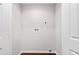Empty laundry room with hardwood floors and white walls at 5 Windsor Ter, Avondale Estates, GA 30002