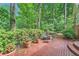 Brick patio in backyard with a table and chairs surrounded by greenery at 8470 Valemont Dr, Atlanta, GA 30350