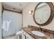 Traditional bathroom with granite counters, tile floors and shower with curtain at 8470 Valemont Dr, Atlanta, GA 30350