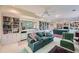 Basement living area with built-in shelving, a wet bar, and comfortable seating at 8470 Valemont Dr, Atlanta, GA 30350