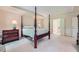 Spacious main bedroom with a four-poster bed and ensuite bathroom access at 8470 Valemont Dr, Atlanta, GA 30350