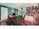 Home office with built-in bookshelves, a vintage desk, and a cozy rug at 8470 Valemont Dr, Atlanta, GA 30350