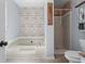 Bathroom featuring a soaking tub, shower, and toilet at 143 Frances Dr, Dallas, GA 30157