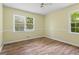 Bedroom with lots of natural light with hardwood floors and light neutral walls at 143 Frances Dr, Dallas, GA 30157
