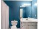 Blue bathroom with vanity, sink, and shower-tub combination at 239 Taylors Farm Drive Dr, Canton, GA 30115
