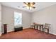 A bedroom featuring a window, ceiling fan, and neutral walls, ready for personal touches and decor at 239 Taylors Farm Drive Dr, Canton, GA 30115