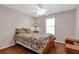Cozy bedroom with natural light, a ceiling fan, and a serene atmosphere for relaxation at 239 Taylors Farm Drive Dr, Canton, GA 30115