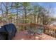 An outdoor deck space with views of mature trees, a place to grill, and outdoor seating for entertaining at 239 Taylors Farm Drive Dr, Canton, GA 30115