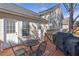Back of house featuring a deck with a grill, dining furniture, a walkout basement and mature trees at 239 Taylors Farm Drive Dr, Canton, GA 30115