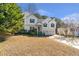 Charming two-story home with a well-manicured front yard and a two-car garage in a residential neighborhood at 239 Taylors Farm Drive Dr, Canton, GA 30115