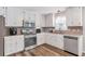 Kitchen with white cabinets, stainless steel appliances, and wood-look flooring at 239 Taylors Farm Drive Dr, Canton, GA 30115