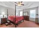 Spacious bedroom featuring a four-poster bed, coffered ceiling, and large windows at 239 Taylors Farm Drive Dr, Canton, GA 30115