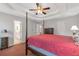 Bedroom with coffered ceiling, four poster bed, dresser, and en-suite bath at 239 Taylors Farm Drive Dr, Canton, GA 30115