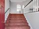 Carpeted staircase leading to upper level, adjacent to kitchen at 239 Taylors Farm Drive Dr, Canton, GA 30115