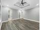 Elegant bedroom with hardwood floors, recessed lighting, tray ceiling and a view of the bathroom at 244 Coastline Road Rd, Fayetteville, GA 30214
