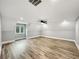 Bright bedroom featuring hardwood floors, a ceiling fan, and a large window at 244 Coastline Road Rd, Fayetteville, GA 30214