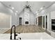 Spacious living room with wood-style floors, vaulted ceilings, marble fireplace, recessed lights and double doors at 244 Coastline Road Rd, Fayetteville, GA 30214