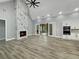 Spacious living room with hardwood floors, a marble fireplace, and sliding glass doors to the outdoor area at 244 Coastline Road Rd, Fayetteville, GA 30214