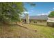 Fenced backyard with grass and a patio area at 11529 Vinea Ln, Hampton, GA 30228