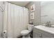 Traditional bathroom with a combined shower and tub and painted cabinets at 11529 Vinea Ln, Hampton, GA 30228