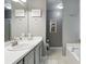 Neutral bathroom with white sink, vanity, and bath tub with shower at 11529 Vinea Ln, Hampton, GA 30228