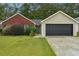 Charming single-story home with brick and siding, a well-manicured lawn, and an attached two-car garage at 11529 Vinea Ln, Hampton, GA 30228