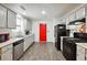 Well-lit kitchen featuring ample counter space and modern appliances at 11529 Vinea Ln, Hampton, GA 30228