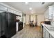 Kitchen and dining area with modern appliances and laminate floors at 11529 Vinea Ln, Hampton, GA 30228