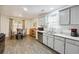 Traditional kitchen with painted cabinets, stainless steel appliances and eat in dining area at 11529 Vinea Ln, Hampton, GA 30228