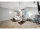 Spacious living room featuring a fan, cozy seating, and neutral color scheme at 11529 Vinea Ln, Hampton, GA 30228
