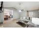 Inviting living room with a cozy seating area open to the kitchen and dining space at 11529 Vinea Ln, Hampton, GA 30228