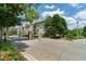 Gated community entrance with lush landscaping, providing a secure and welcoming environment at 220 Renaissance Ne Pkwy # 1115, Atlanta, GA 30308