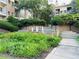 Exterior view featuring a serene fountain and landscaped grounds with colorful flowers at 220 Renaissance Ne Pkwy # 1115, Atlanta, GA 30308