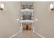 Stunning multi-level hallway featuring hardwood floors, recessed lighting, and unique architectural design at 220 Renaissance Ne Pkwy # 1115, Atlanta, GA 30308